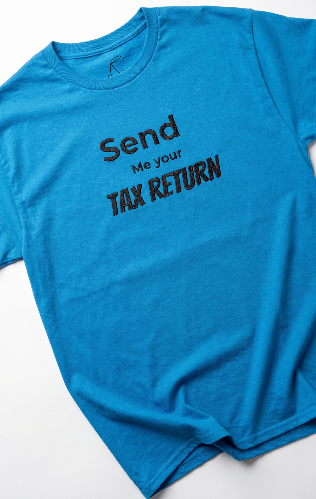 A bright blue crewneck t-shirt with black printed text reading 'Send Me your TAX RETURN' on the front, laid flat on a white background.