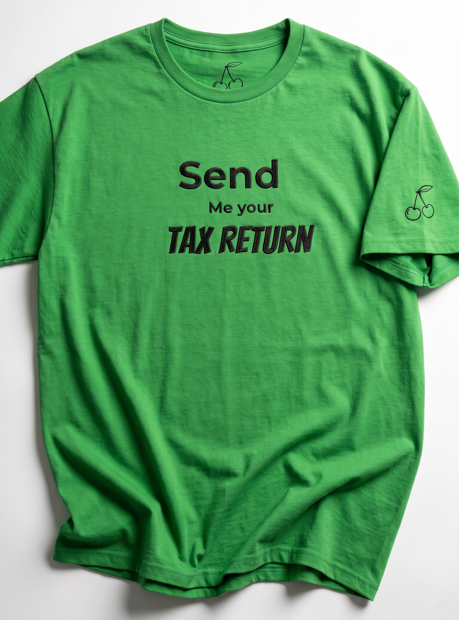 A bright green short-sleeve t-shirt with black printed text reading 'Send Me your TAX RETURN' on the front, laid flat against a light gray background.