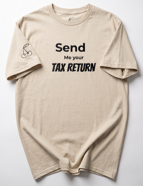 A beige crewneck t-shirt with black text reading 'Send Me your TAX RETURN' on the front, laid flat against a light gray background.