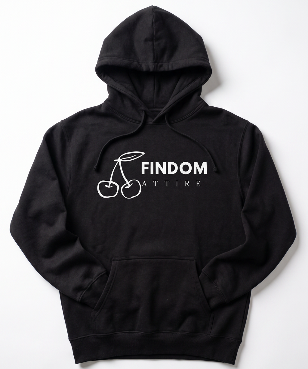 A black pullover hoodie with a white graphic on the chest depicting two cherries and the text 'FINDOM ATTIRE', displayed flat against a light gray background.
