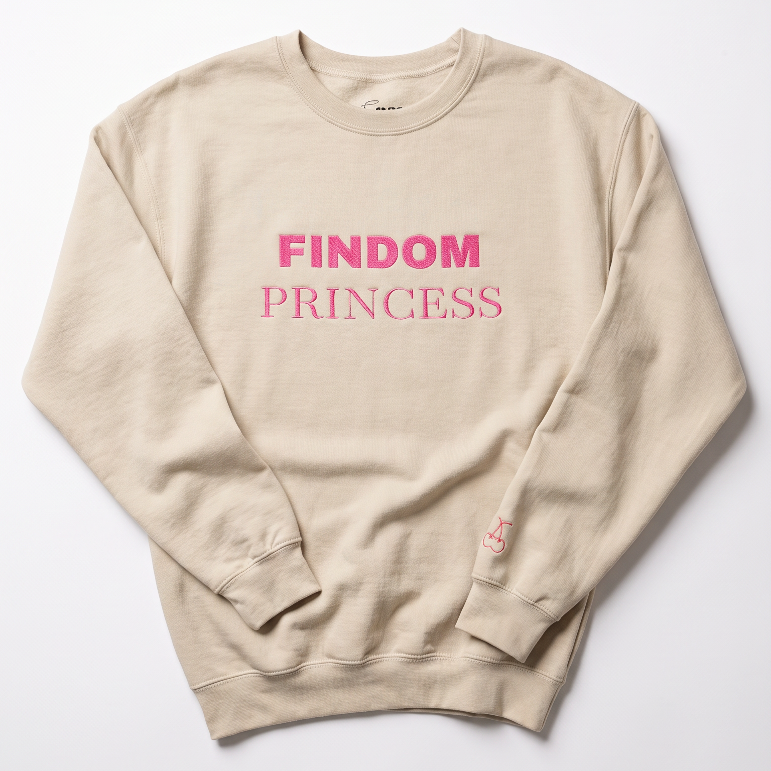 A beige crewneck sweatshirt with 'FINDOM PRINCESS' printed in pink across the chest, laid flat on a light gray background.